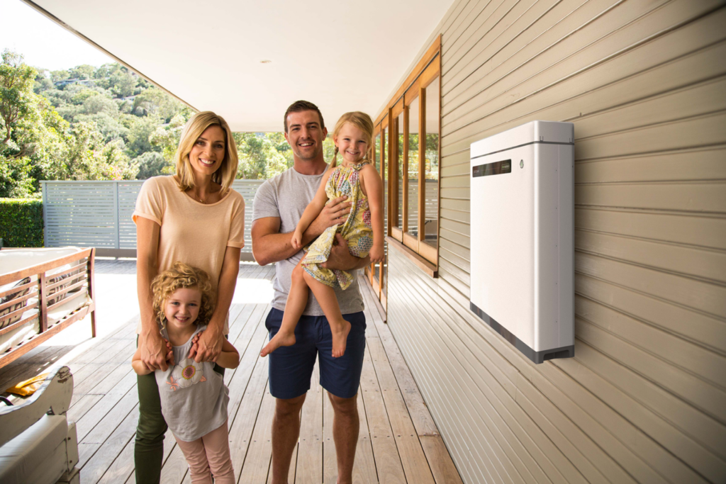 family standing next to GoodWe Inverter